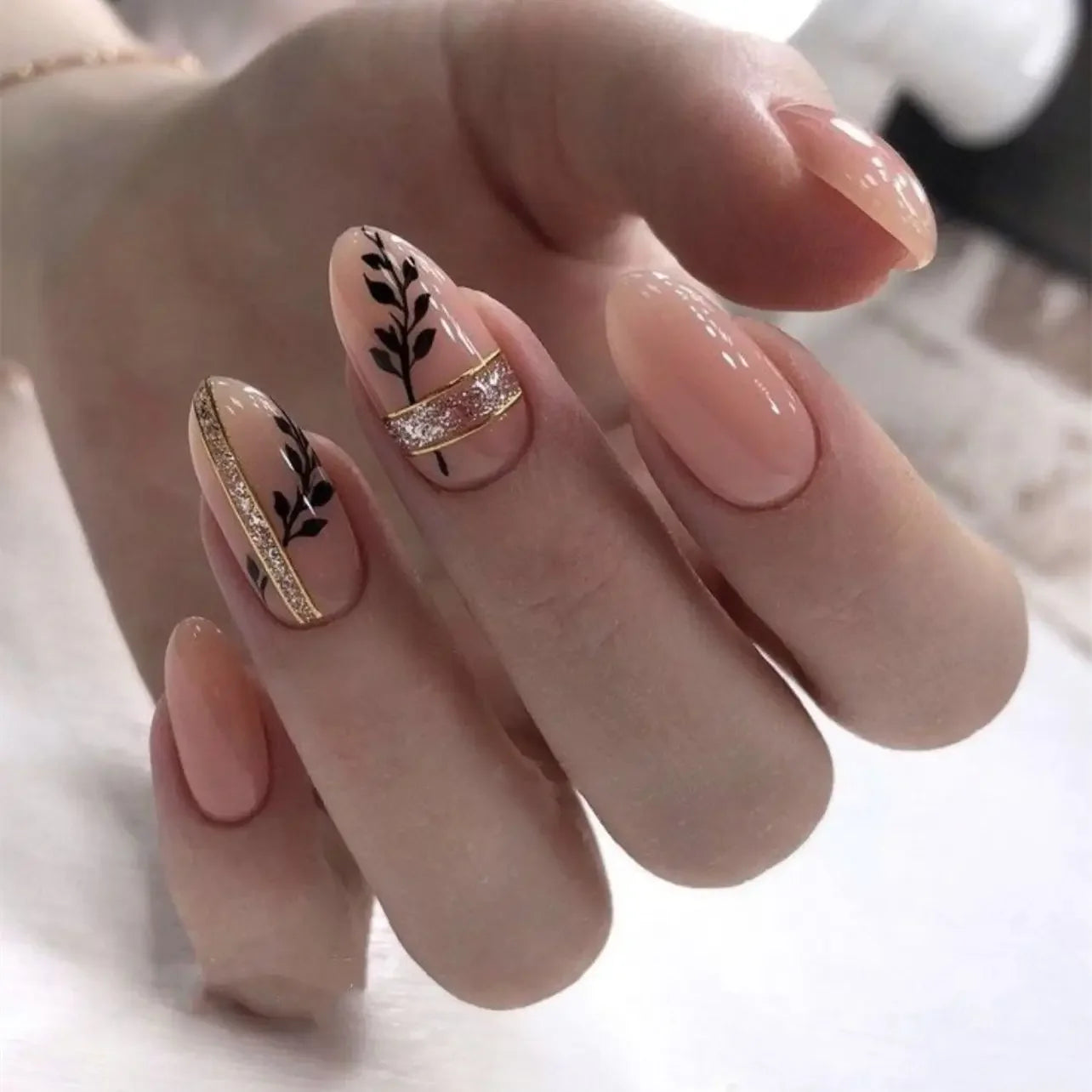Almond shaped false nails with glue